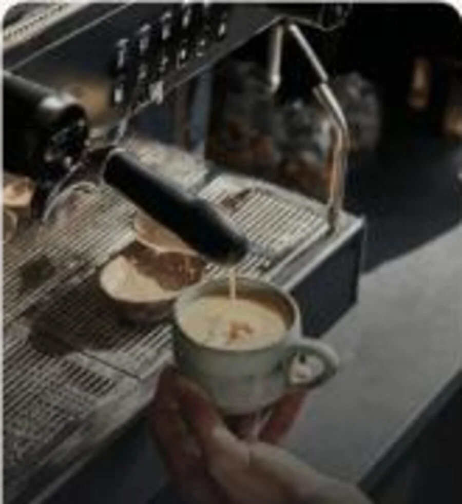 Coffee being prepared at an espresso machine